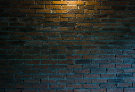 Brick wall with light at night. Texture of brick wall.