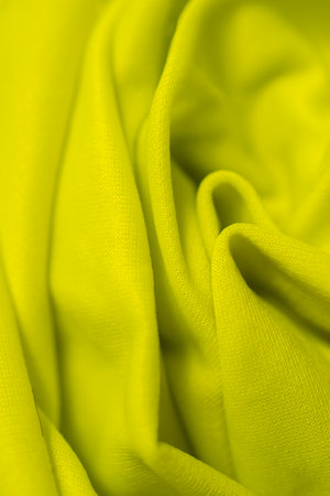 Texture, background, pattern. The fabric is yellow. Yellow silk crepe de chine.の写真素材