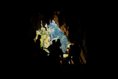 Cave in Krabi province, Thailand. Silhouette peopleの写真素材