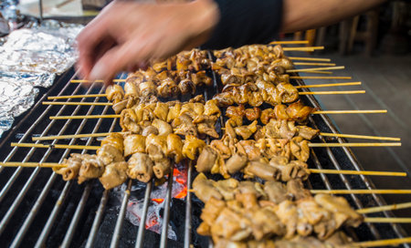 Grilled chicken on the grill, Thai street food in Thailand.の写真素材