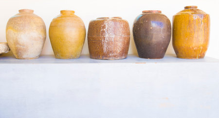 Ceramic vases on the shelf in the kitchen, stock photoの写真素材