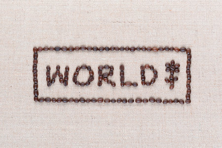 World sign made from coffee beans near a flower icon enclosed in rectangle isolated on creamy linea canvas, shot top view, close up.の写真素材