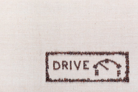 Word drive next to a fuel gauge inside a rectangle all made up from coffee beans, aligned in the bottom right.の写真素材