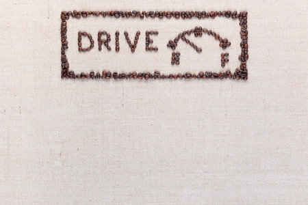 Word drive next to a fuel gauge inside a rectangle all made up from coffee beans, aligned at the top in the middle.の写真素材