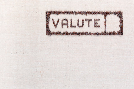 The word valute inside a rectangle written with coffee beans on creamy linea canvas, shot from above,aligned at the top right.の写真素材