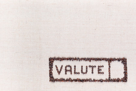 The word valute inside a rectangle written with coffee beans on creamy linea canvas, shot from above,aligned at the bottom right.の写真素材