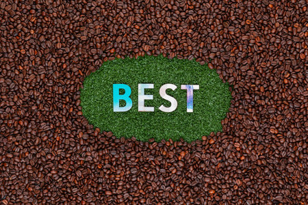 Word Best with colorful letters on artificial grass surrounded by roasted coffee beansの写真素材