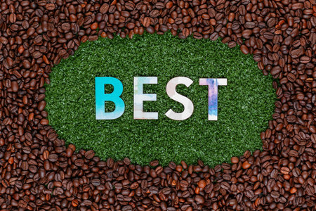 Close up of Best word made from colorful letters on artificial grass surrounded by roasted coffee beansの写真素材