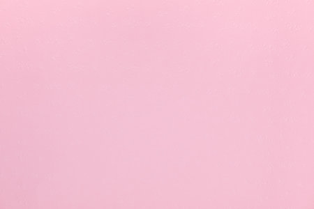 Pink background shot from above with a slightly bumped texture on surfaceの写真素材