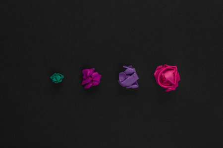 A graph made from colorful crumbles of plasticine on black background, shot from above.の写真素材