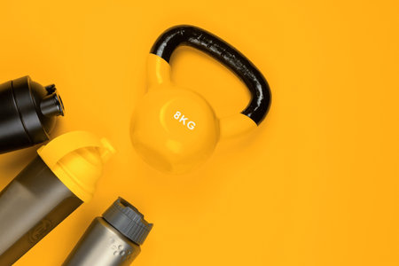 Gym equipment on yellow background, shot from above.の写真素材