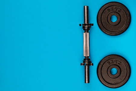 Some weights on blue background, shot form above.の写真素材