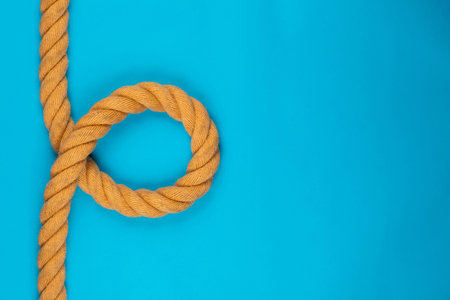 A gym battle rope on blue background, shot from above.の写真素材