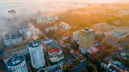 A beautiful shot of a city in the morning at sunrise in the fog.