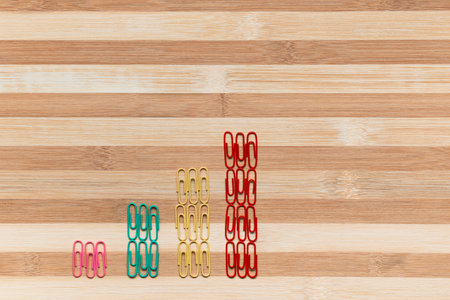 A bunch of paperclips arranged in columns on a table, shot from above.の写真素材