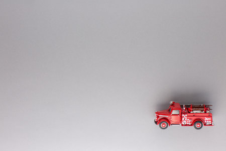 A red truck figurine, shot from above, white background.の写真素材