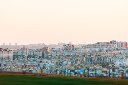 A shot of a beautiful city and a green plain during the day.の写真素材