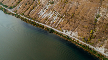 A lake at the bottom of a valley, shot from above.の写真素材