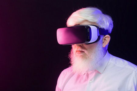 Closeup view of an old albino man wearing a vr set and looking to the left, isolated on a beautiful,...