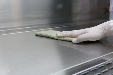 soft focus scientist was cleaning laminar flow hood, and her wear rubber glovesの写真素材