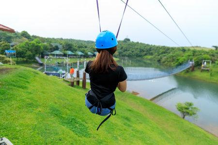 Apr 23, 2017 Woman sliding on a zip line adventure at Mountain lake resort in Laguna, Philippines
