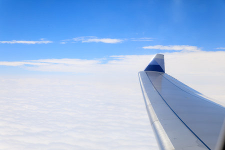 View of beautiful cloud and wing of airplane from window