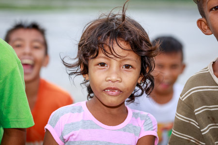 Portrait of Aeta tribe little girl near Mount Pinatubo on Aug 27, 2017 in Santa Juliana, Capas, Central Luzon, Philippines.のeditorial素材