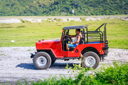 Tourists riding on ATV on Aug 27, 2017 in Mount Pinatubo, Luzon, Philippinesのeditorial素材