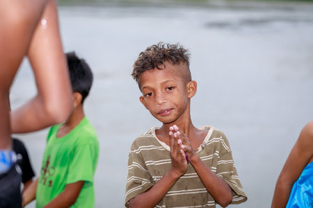 Portrait of Aeta tribe little boy near Mount Pinatubo on Aug 27, 2017 in Santa Juliana, Capas, Central Luzon, Philippines. the people suffer of poverty due to the bad economy, political issue.のeditorial素材