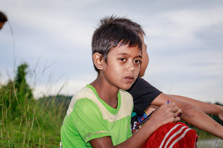 Portrait of Aeta tribe little boy near Mount Pinatubo on Aug 27, 2017 in Santa Juliana, Capas, Central Luzon, Philippines. the people suffer of poverty due to the bad economy, political issue.のeditorial素材