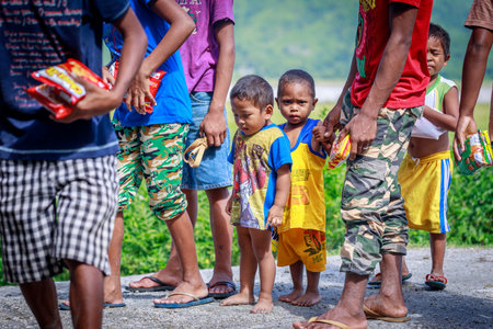 The Aeta tribe children near Mount Pinatubo on Aug 27, 2017 in Santa Juliana, Capas, Central Luzon, Philippines. the people suffer of poverty due to the bad economy, political issue.のeditorial素材