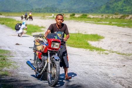 Filipino people riding motorcycle along the volcanic field near Mount Pinatubo on Aug 27, 2017 in Santa Juliana, Capas, Central Luzon, Philippinesのeditorial素材