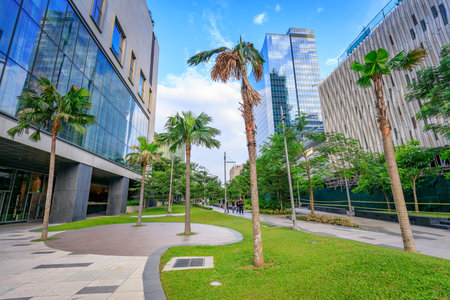 Walkway at a park and skyscrapers at Bonifacio Global City on Sep 1, 2017 in Taguig, Metro Manila, Philippinesのeditorial素材