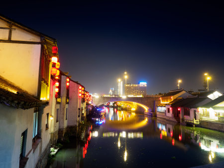 Night scene of Nanchang ancient street. Nanchang - historic scenic town (a canal, boats, historic houses and chinese lanterns) on Nov 11, 2017 located in Wuxi Shi, Chinaのeditorial素材