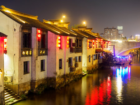 Night scene of Nanchang ancient street. Nanchang - historic scenic town (a canal, boats, historic houses and chinese lanterns) on Nov 11, 2017 located in Wuxi Shi, Chinaのeditorial素材