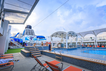 Main Pool deck facility with beach seats of Dream Cruises sailing away from Hong Kong on Nov 21, 2017 at port of Manila, Philippinesのeditorial素材