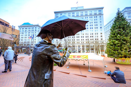 Portland, United States - Dec 19, 2017 : Allow Me, also known as Umbrella Man, is an iconic 1983...