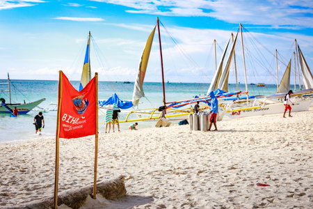 BORACAY ISLAND, PHILIPPINES - November 18, 2017 : Traditional Sailboats on Crowded Boracay white...