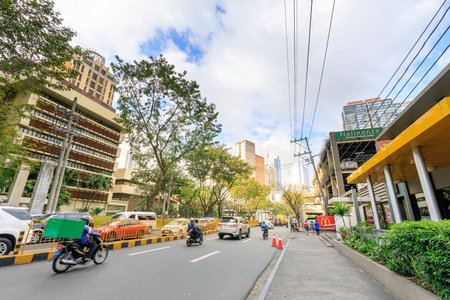 MAKATI, MANILA, PHILIPPINES - JAN 31, 2018 : Road view beside Greenbelt Shopping Mall taken in Edades St.のeditorial素材