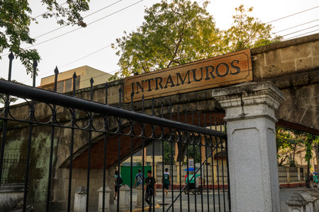 Manila, Philippines - Feb 4, 2018 : Intramuros entrance sign over the ruins of the walls