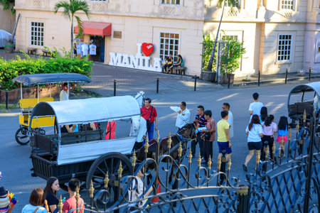 Manila, Philippines - Feb 17, 2018 : Horse with carriage waiting for tourists in Intramuros districtのeditorial素材