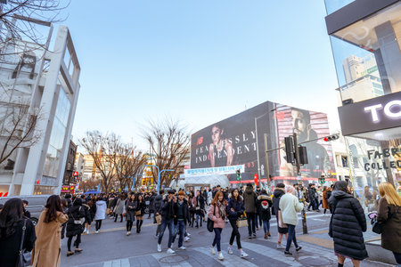 Seoul, South Korea - March 2, 2018 : Local shops - lined at Hongdae (Hongik University) shopping street. Hongdae is a shopping cultural street for young people in Seoul.のeditorial素材