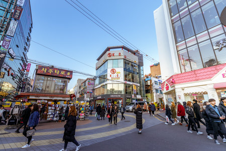 Seoul, South Korea - March 2, 2018 : Local shops - lined at Hongdae (Hongik University) shopping street. Hongdae is a shopping cultural street for young people in Seoul.のeditorial素材
