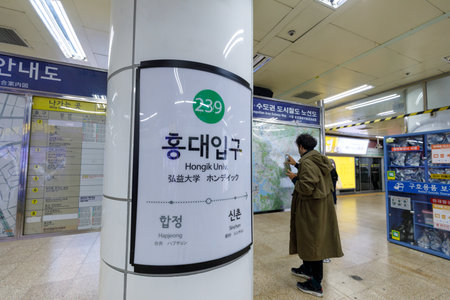 Seoul, South Korea - March 6, 2018 : Signboard of Hongdae (Hongik University) subway in Seoul cityのeditorial素材