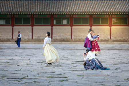 Seoul, South Korea - Apr 6, 2018 : Asian Korean woman dressed Hanbok in traditional dress walking in Gyeongbokgung Palaceのeditorial素材