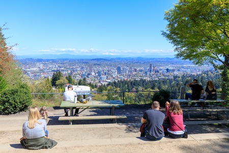 Portland, Oregon, USA - April 19, 2018: Tourists looking Portland skyline at Pittock mansion, OR