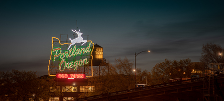 Sunset over the iconic Portland, Oregon Old Town sign in downtown Portland, Oregonのeditorial素材