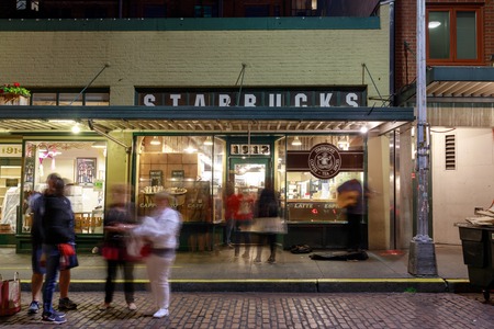 Seattle, Washington - June 30, 2018 : Original Starbucks store at 1912 Pike Place in Seattle. Serving coffee in 20.891 stores in 62 countries, Starbucks is world's largest coffeehouse company.のeditorial素材