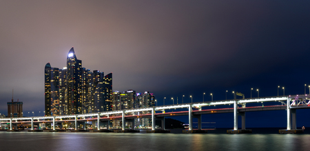 Busan, South Korea - Aug 9, 2018 : Cityscape of Haeundae District with luxury skyscrapers and bridge in eveningのeditorial素材