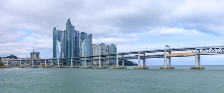 Busan, South Korea - Jul 12, 2018 : Cityscape of Haeundae District with luxury skyscrapers and Gwangan bridgeのeditorial素材
